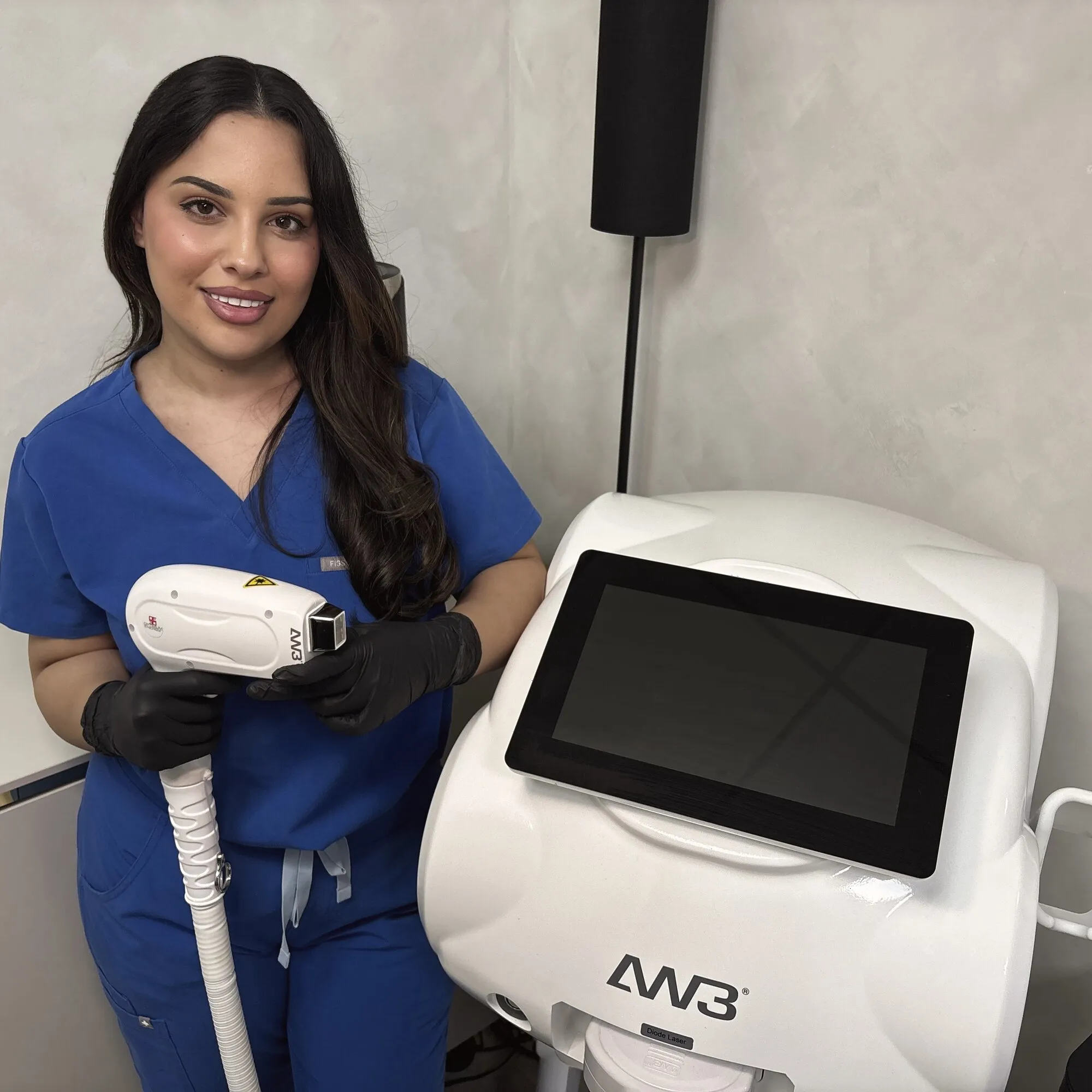 Fatima at the AW3, holding the handpiece